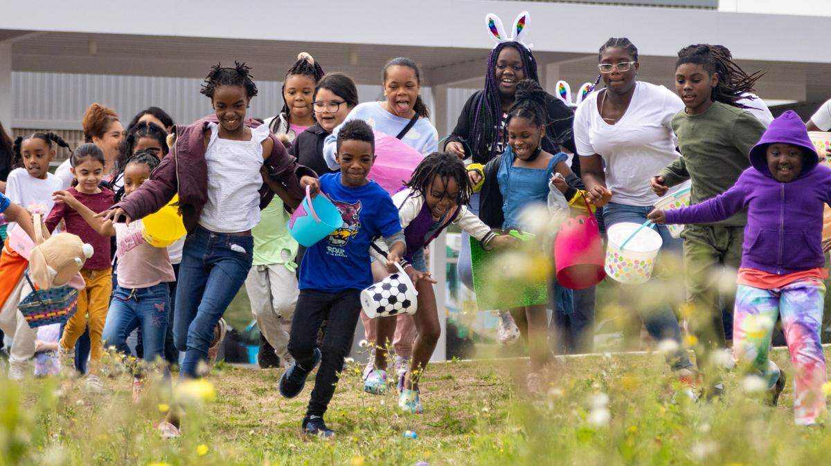 Kids surge forward as the annual Easter egg hunt begins at the Como Community Center in Fort Worth on Saturday, April 8, 2023.