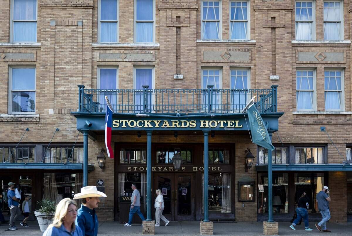 People walk around the Stockyards Hotel on Friday, May 22, 2026 in Fort Worth, Texas. The Stockyards Hotel and H3 Ranch are both closed for renovations to upgrade the building.