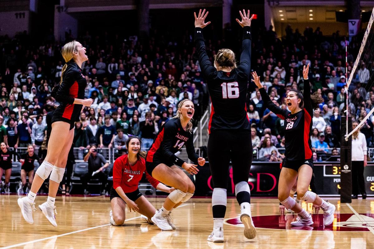 The Panthers celebrate after Ella Busey (16) slams down the final kill, defeating Frisco Reedy in the 5A state final at the Curtis Culwell Center in Garland on November 19th, 2022.