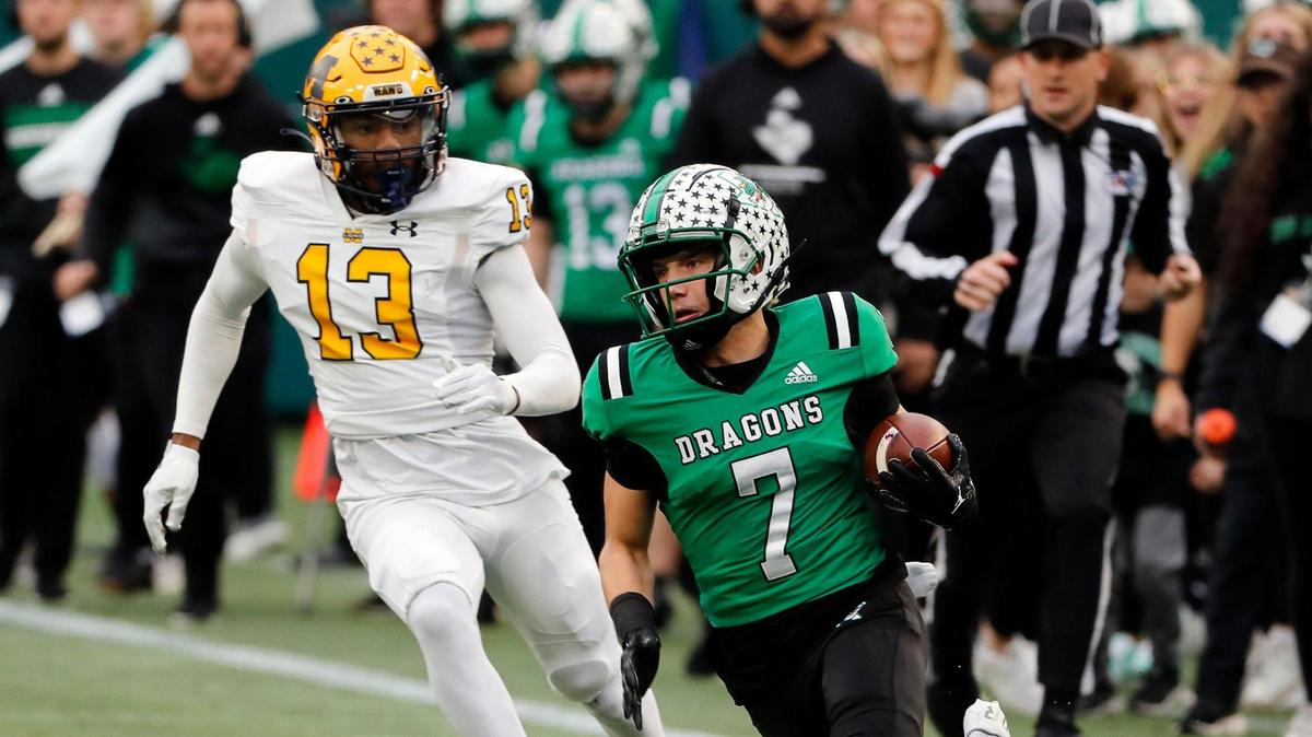 Southlake Carroll wide receiver Jacob Jordan (7) takes a pass downfield in front of McKinney safety Christian Ford (13) in the first half of Class 6A D2 regional semi-finals football game at Choctaw Stadium in Arlington, Texas, Friday, Nov. 25, 2022. Carroll tied the game at 7 with 28.6 seconds remaining in the half but McKinney stormed back in 21 seconds and made the game 14-7. (Special to the Star-Telegram Bob Booth)