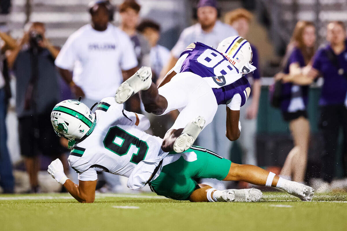 Southlake Carroll defensive back William Chen (9) makes a tackle on a Keller Timber Creek wide receiver Julian Williams (88) in a district matchup on Thursday, September 25, 2025 at Keller ISD Stadium in Keller, Texas.