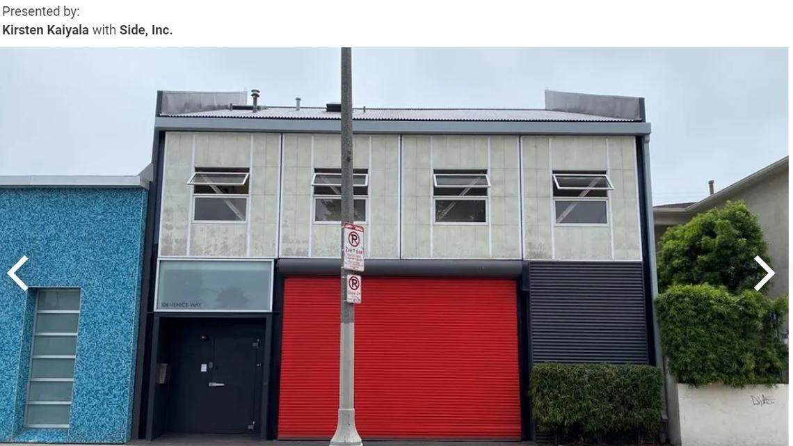 The bright red pops in a neighborhood filled with artsy homes.