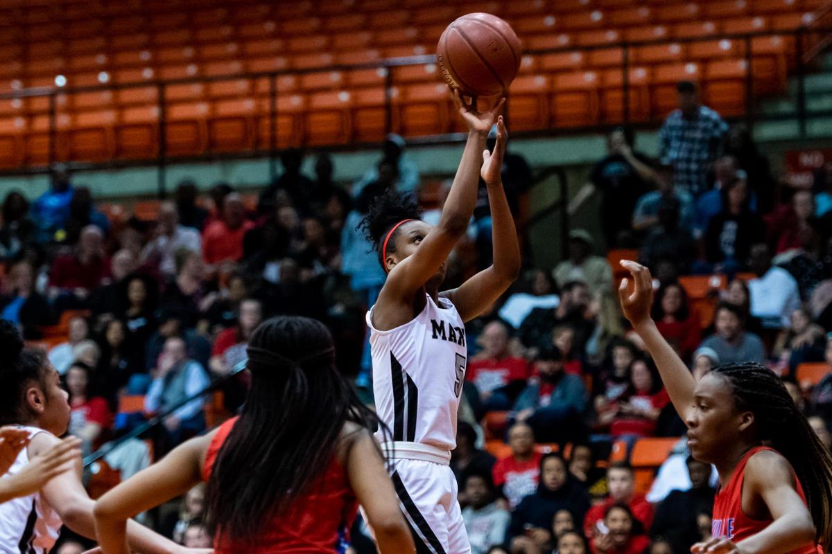 Mariah Roberts (5) attempts a shot from the outside during the 2nd half of the Region 1 Semifinal between Arlington Martin and Duncanville at the Wilkerson-Greines Activity Center in Ft. Worth, on February 28, 2019. (Photo by Matt Smith-Special to the Star-Telegram)