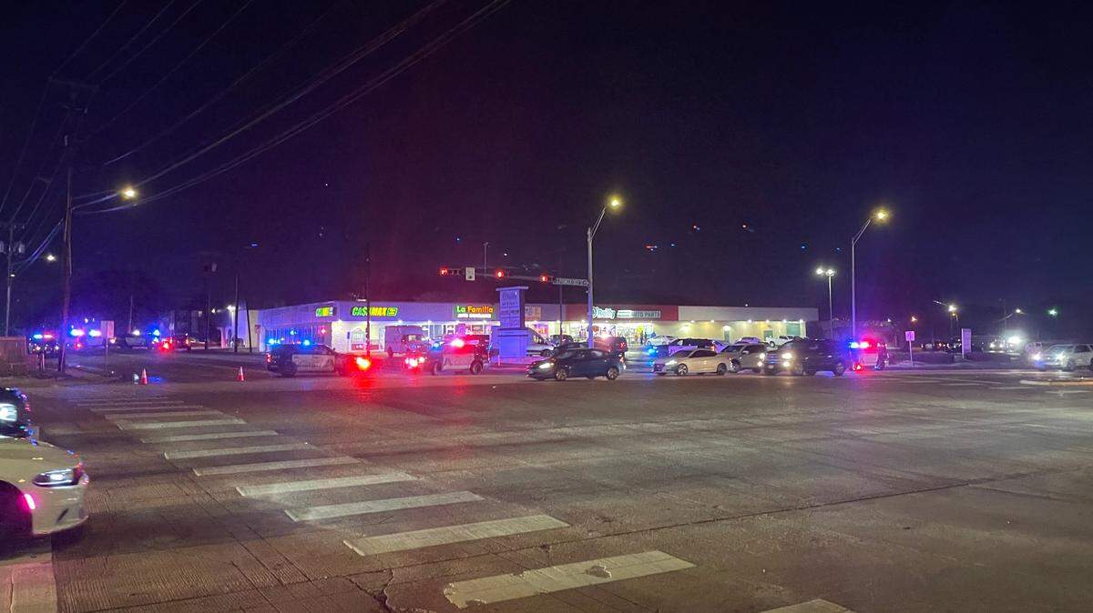 A heavy police presence surrounds CashMax in the 600 block of W. Pioneer Parkway in Arlington after officers exchanged gunfire with a robbery suspect on Friday night, Jan. 10, 2025. As of Monday, Jan. 13, police are still searching for one of the suspects.