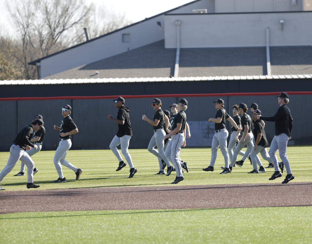 Fort Worth Christian baseball players warm up before baseball practice at Fort Worth Christian School in North Richland Hills, Texas, Monday, Feb. 23, 2026.