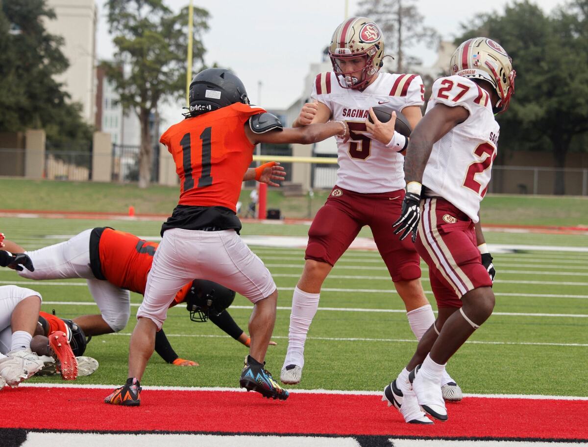 Saginaw quarterback Roman Morales (5) crosses the goal line for six during a UIL football game at Farrington Field in Fort Worth Saturday, Sept. 14, 2024.