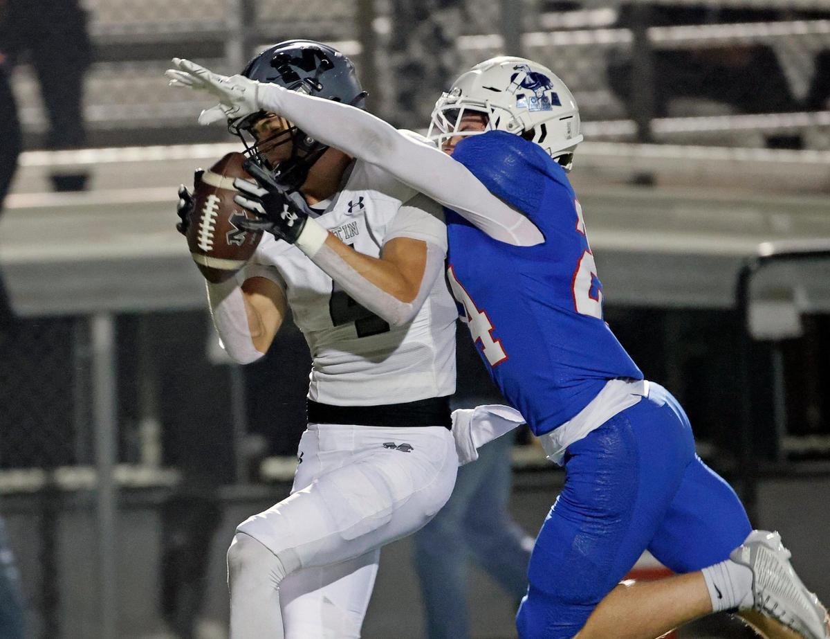 Martin tight end Logan Baresh (4) hauls in a pass contested by Allen defensive back Ethan Sa (24) in the first half of a UIL Conference 6A Division 1 area round football playoff game at Dragon Stadium in Southlake Texas, Friday, Nov. 17, 2023.