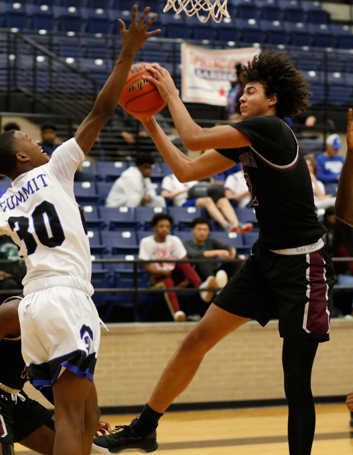Timberview’s Cameron Taylor (2) grabs a defensive rebound from Summit’s David Terrell (30). Mansfield Summit played Mansfield Timberview in the Spring Creek Barbecue Classic Tournament in high school basketball at Lake Ridge high school gym Friday, Dec. 6, 2019.