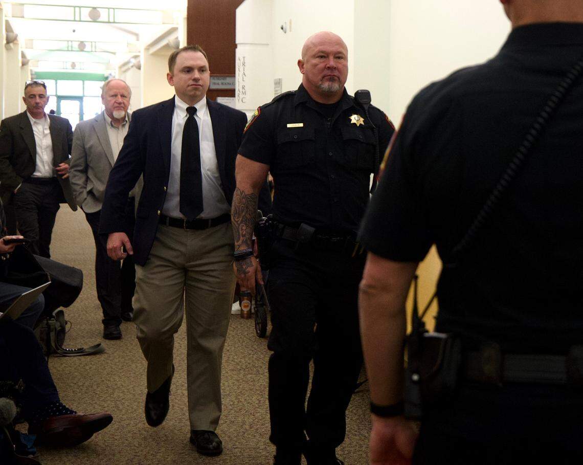 Aaron Dean walks in to a pretrial hearing Nov. 16, 2022, at Tim Curry Criminal Justice Center in downtown Fort Worth. Dean, a former Fort Worth police officer, is scheduled for trial Monday on a murder charge in the shooting death of Atatiana Jefferson.