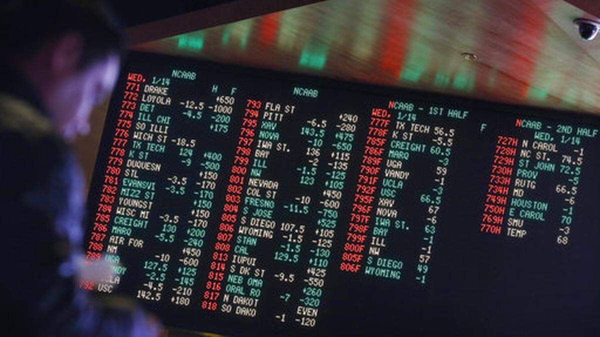 FILE - In this Jan. 14, 2015, file photo, odds are displayed on a screen at a sports book owned and operated by CG Technology in Las Vegas. More than a third of U.S. states are considering legalizing sports gambling if the Supreme Court overturns a federal law that has banned sports books in all but Nevada and three other states since 1992. (AP Photo/John Locher, File)