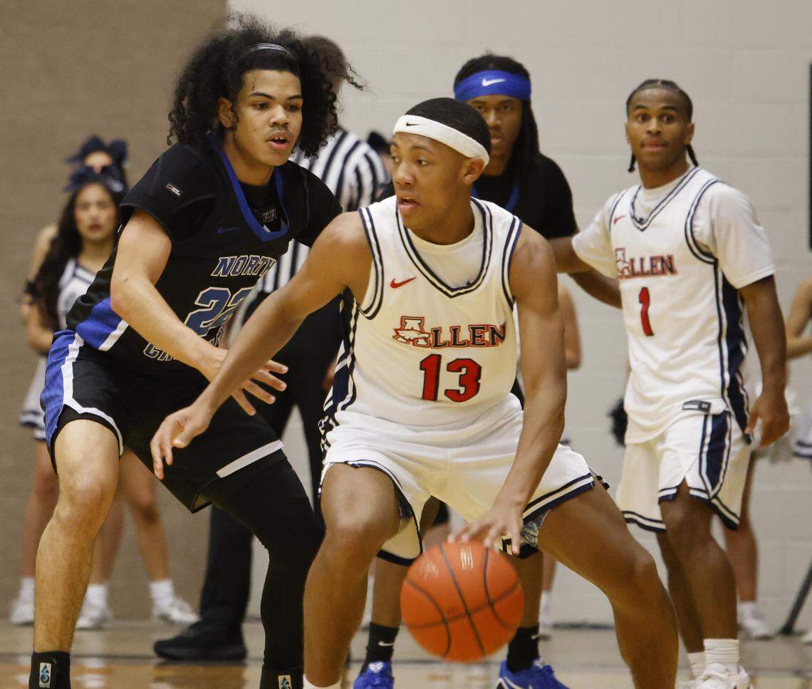 Allen's Bennett Mosley (13) attempts to shake the defense of North Crowley guard Isaak Hayes (22) during the first half of a UIL Class 6A Division I boys regional final basketball game at Thomas Coliseum in Haltom City, Texas, Friday, Mar. 06, 2026.
