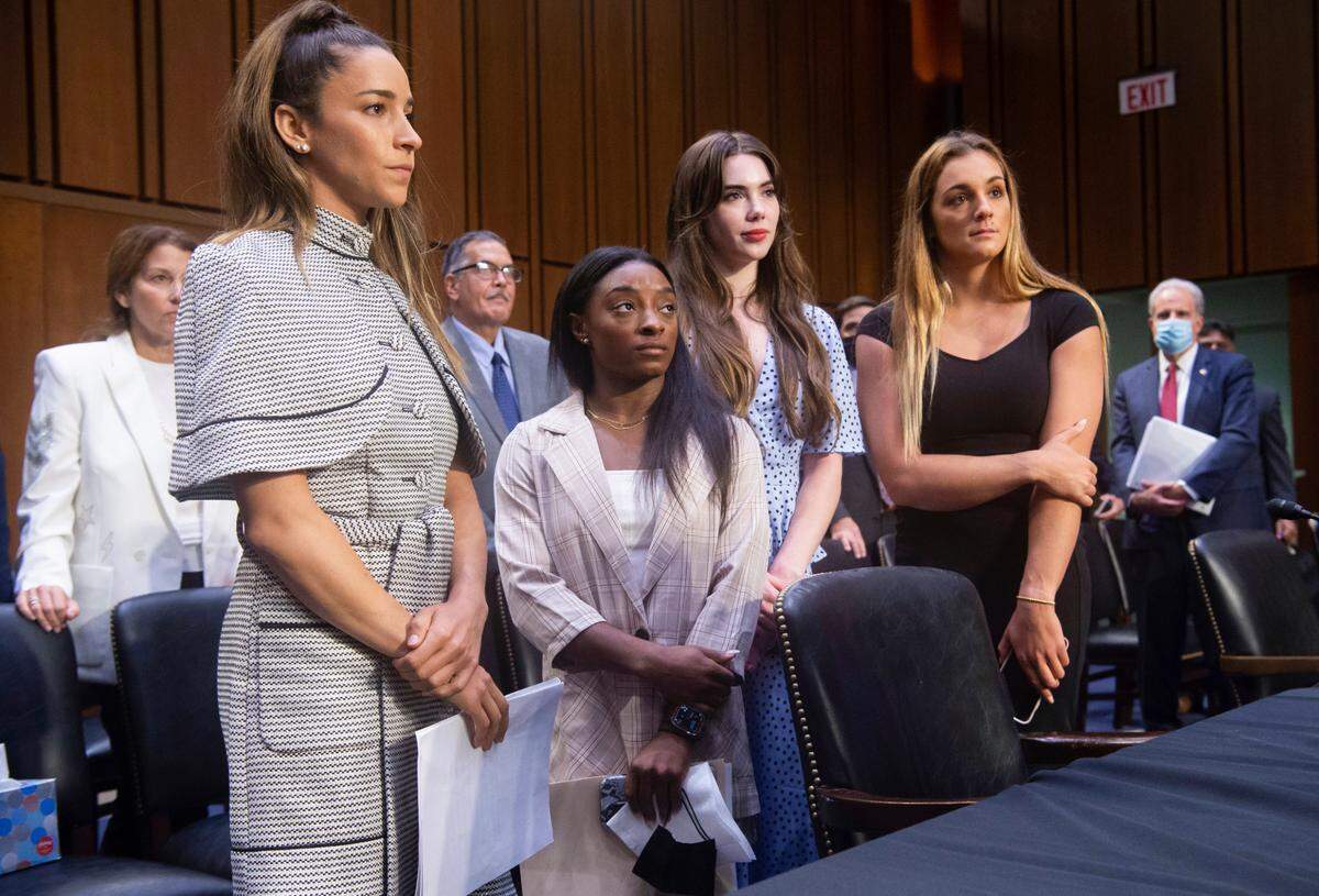 United States gymnasts from left, Aly Raisman, Simone Biles, McKayla Maroney and Maggie Nichols, leave after testifying at a Senate Judiciary hearing about the Inspector General’s report on the FBI’s handling of the Larry Nassar investigation on Capitol Hill, Wednesday, Sept. 15, 2021, in Washington. Nassar was charged in 2016 with federal child pornography offenses and sexual abuse charges in Michigan. He is now serving decades in prison after hundreds of girls and women said he sexually abused them under the guise of medical treatment when he worked for Michigan State and Indiana-based USA Gymnastics, which trains Olympians. (Saul Loeb/Pool via AP)