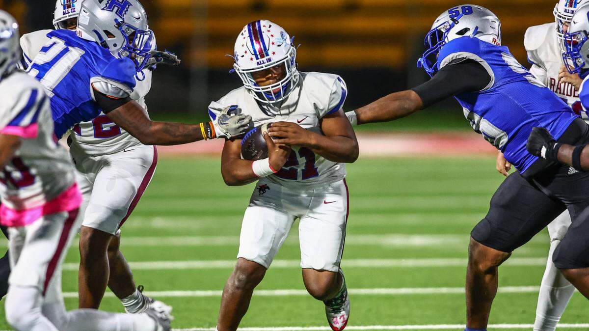 Fort Worth Southwest quarterback Zachariah Cain runs between Fort Worth Eastern Hills defenders on Thursday, Oct. 17, 2024 at Scarborough-Handley Field in Fort Worth, Texas.