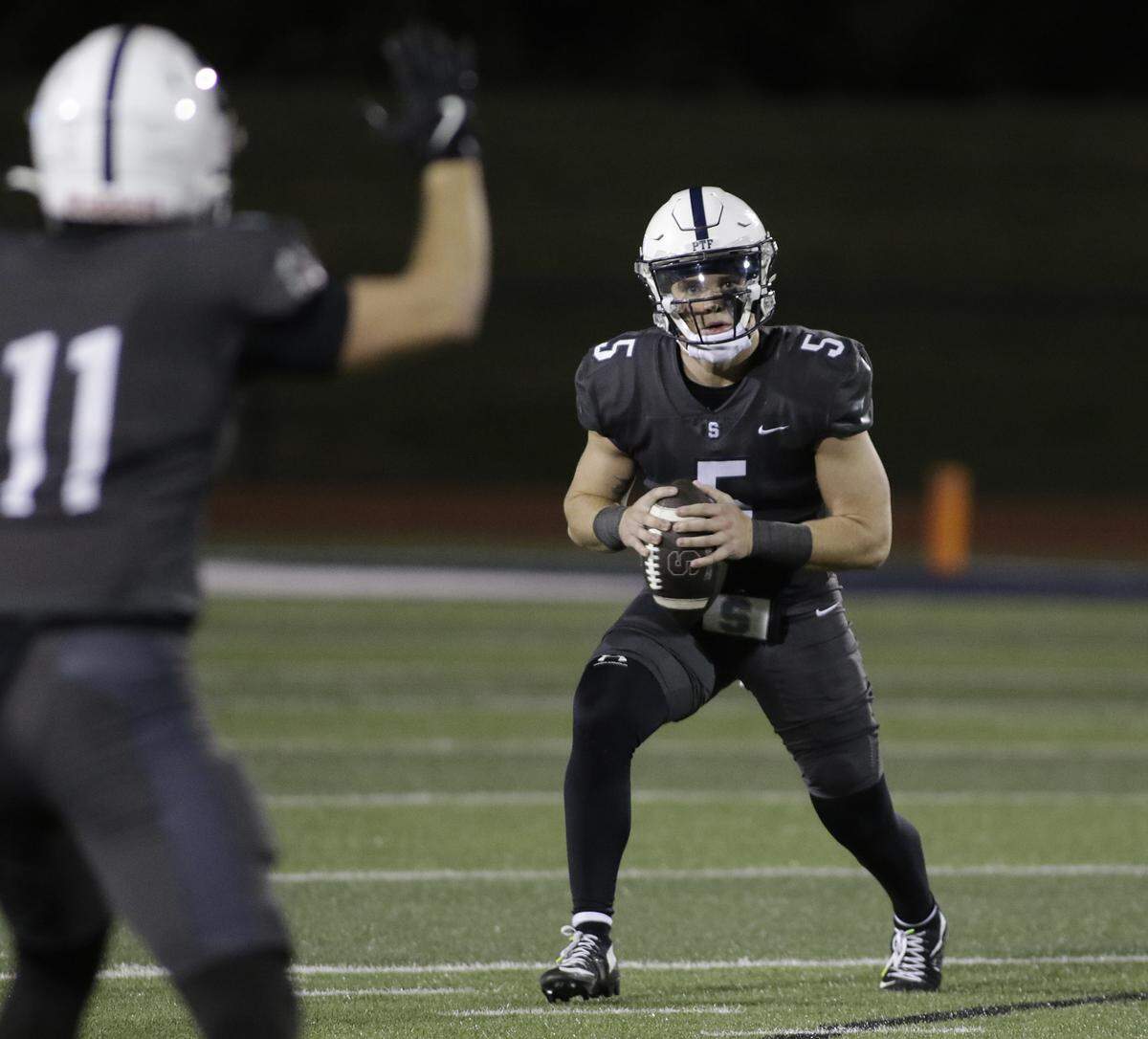 All Saints Episcopal’s Gavin Breard looks for a receiver against Grapevine Faith during their game at All Saints Episcopal on Friday, Oct. 10, 2025.