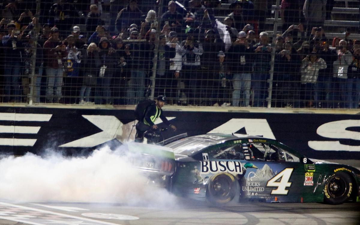 Monster Energy NASCAR Cup Series driver Kevin Harvick (4) does a burnout in front of fans on the front stretch after winning the NASCAR Monster Energy Series AAA Texas 500 at Texas Motor Speedway in Fort Worth, Texas, Sunday, Nov. 3, 2019.