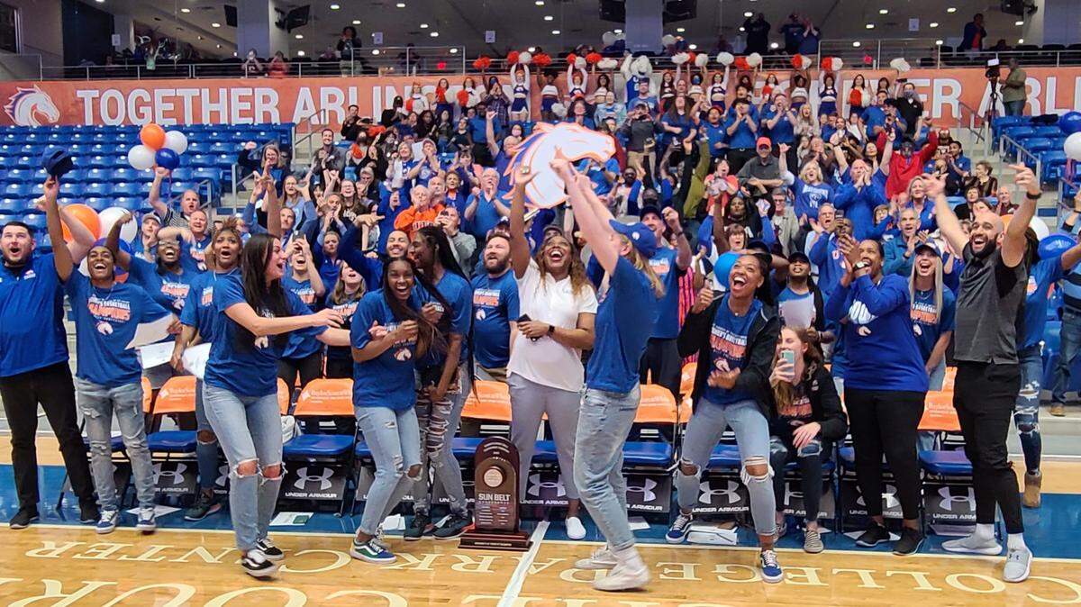 Members and supporters of the 14-seed UT Arlington Mavericks celebrate after hearing that they will face the 3-seed Iowa State Cyclones in Ames in a first-round NCAA Tournament game on Friday. (Photo by Ricky Moore / Special to the Star-Telegram)