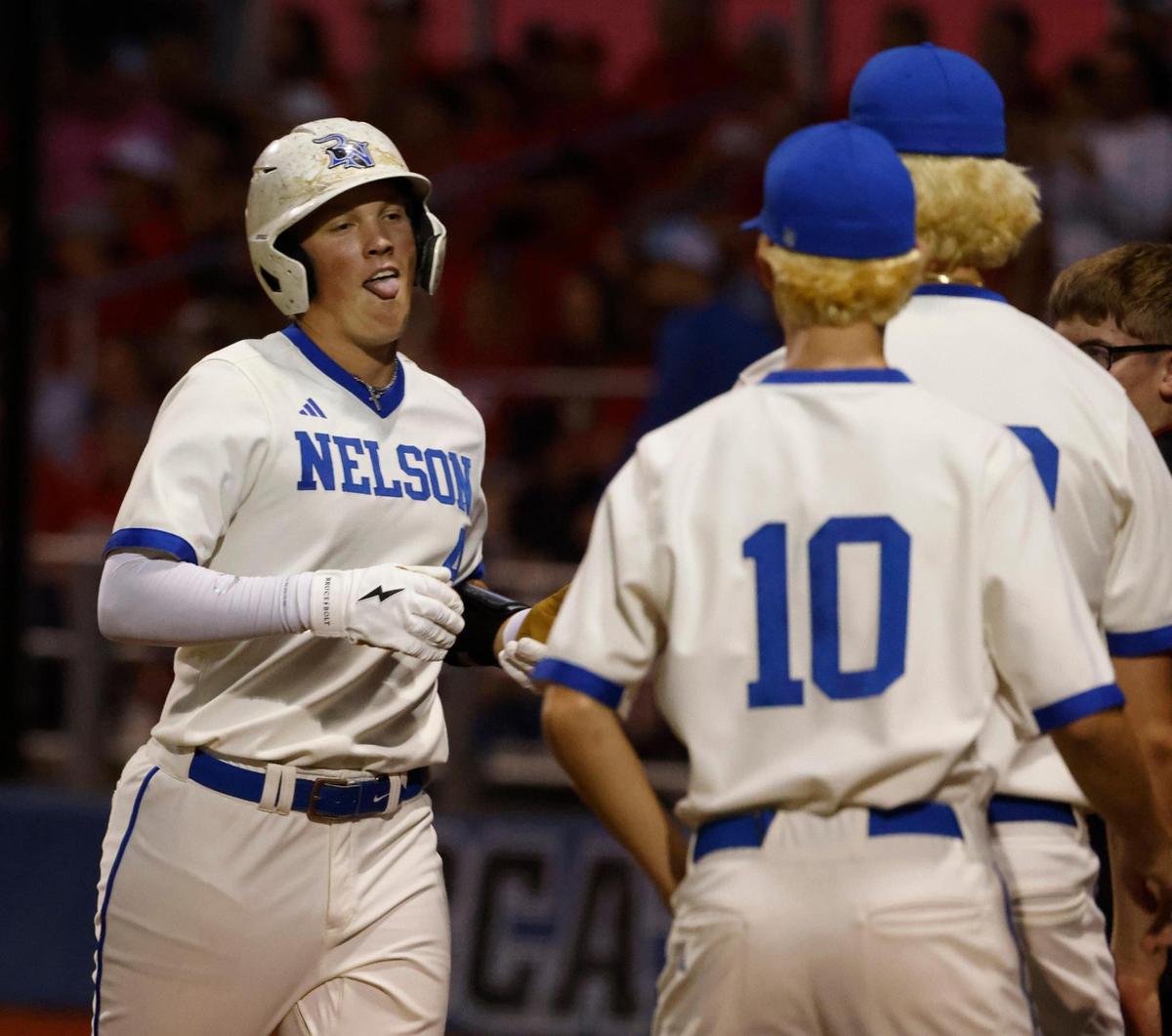 Byron Nelson third baseman Colton Smith (4) is welcomed to the dugout after scoring during a UIL Regional Seminal 6A D2 baseball playoff game at Bobcat Field in Trophy Club, Texas, Thursday, May 15, 2025.