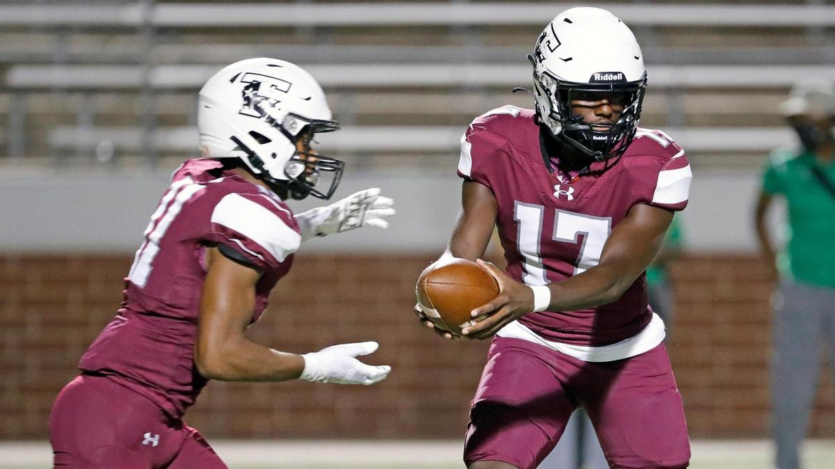 Timberview quarterback Zuric Humes (17) hands the ball to running back Jaylon Woods (11) in the second half of a high school football game at Vernon Newsom Stadium in Mansfield Texas, Thursday, Sept. 22, 2022. Timberview defeated Newman Smith 56-8. (Special to the Star-Telegram Bob Booth)