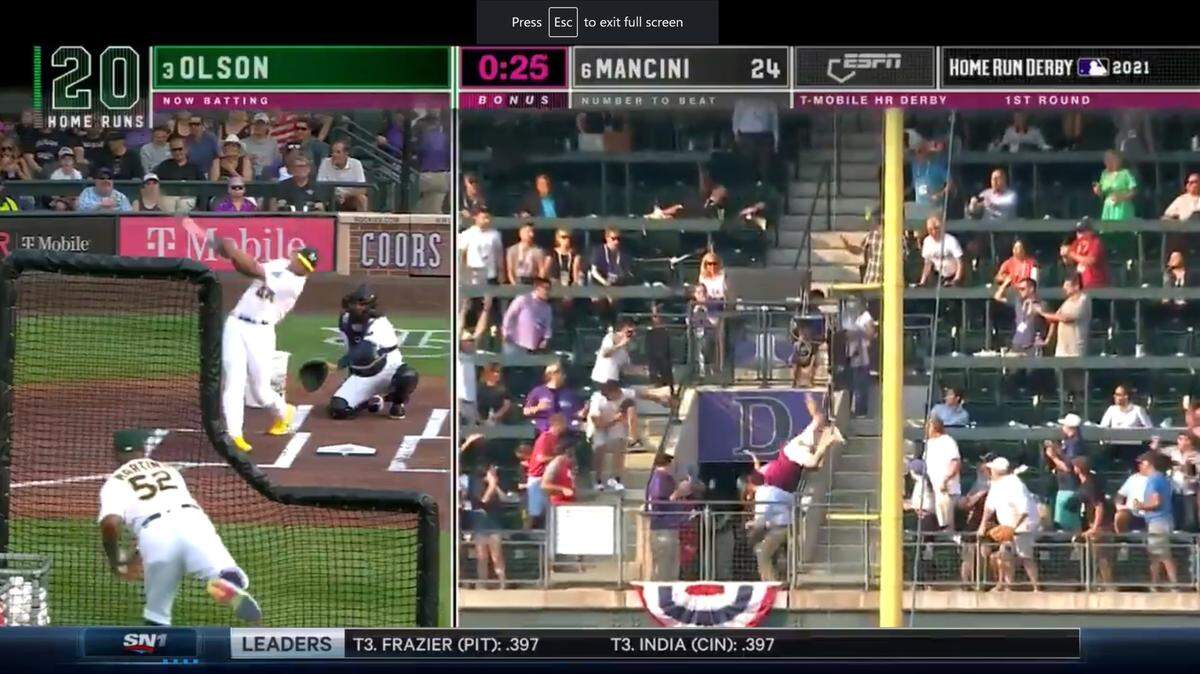 A fan took a risky looking tumble over the railing at Coors Field on Monday.