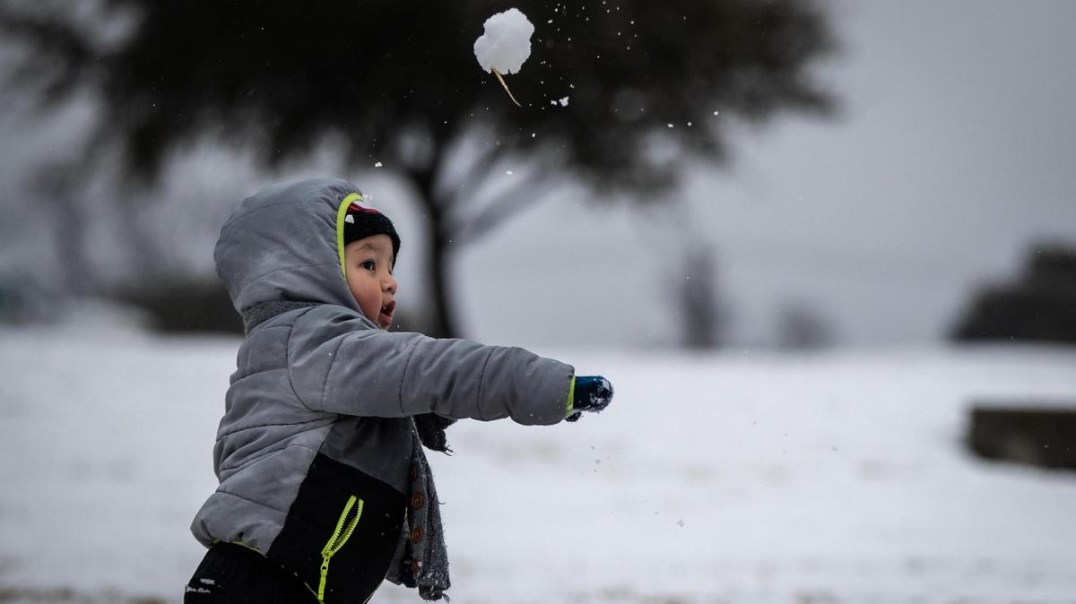 Emanuel Palacios, 2, throws a snowball at his family Sunday, Jan. 10, 2021, near Benbrook Community Center. The National Weather Service in Fort Worth predicted 1 inch to 2 inches of snow would fall in Tarrant and Dallas counties over the course of the day.