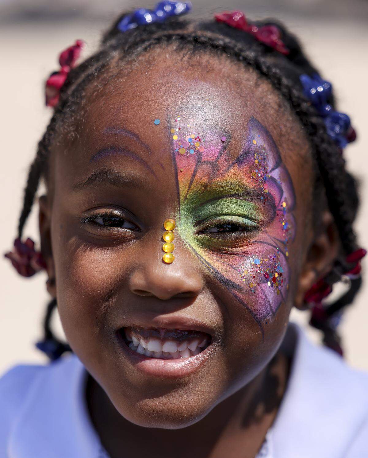 Abigail Shoalts, 5, has a butterfly painted on her face during Mayfest at Trinity Park on Saturday, May 2, 2026, in Fort Worth, Texas. This year marks 54 years since the festival was founded.