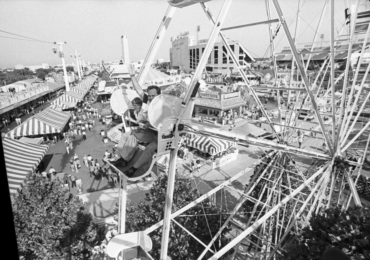 Oct. 8, 1978: Art Cunningham and his son, Mike, of Tyler riding the Ferris wheel at the State Fair of Texas.