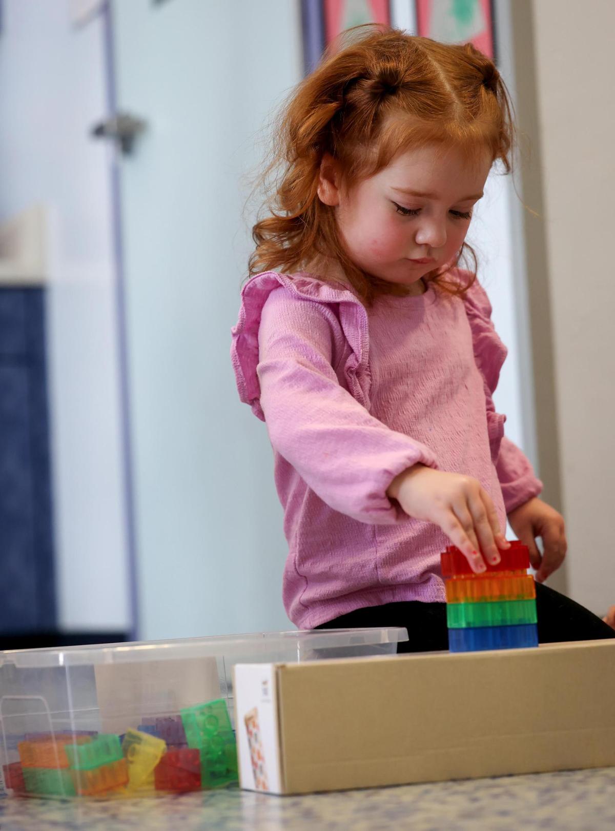 Meryle, 2, plays with blocks while being cared for at Kids’ Place Child Development Center on Wednesday, Jan. 15, 2025, in Fort Worth.