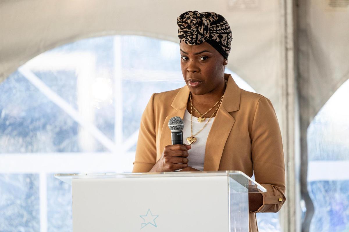Resident Timmie Smith speaks at the grand opening of the Casa de los Sueños apartments in Fort Worth on Wednesday, Dec. 11, 2024. Smith, a single mother of 5, experienced homelessness in 2012.