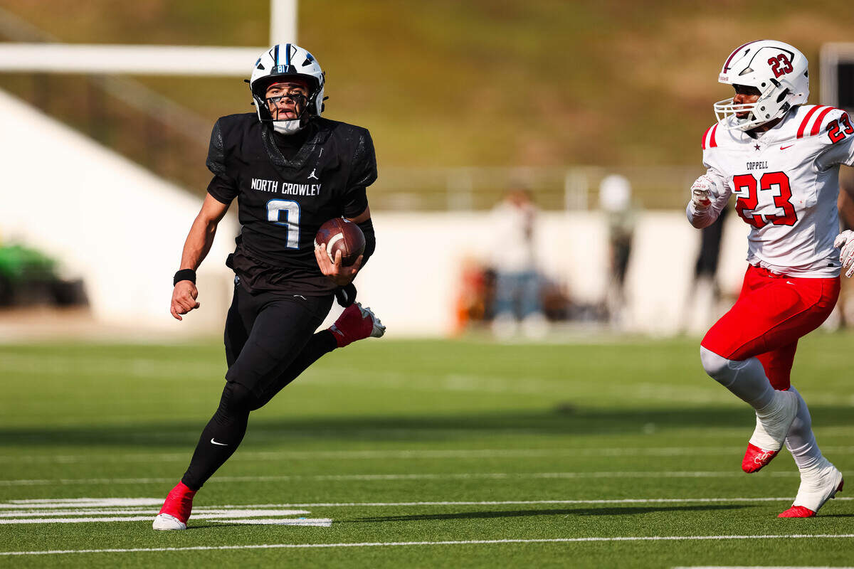North Crowley quarterback Hayes Cloutier (9) runs with the ball past Coppell linebacker Lincoln Gardner (23) in a Class 6A Division I regional playoff Saturday, Nov. 29, 2025, at Midlothian ISD Stadium in Midlothian.