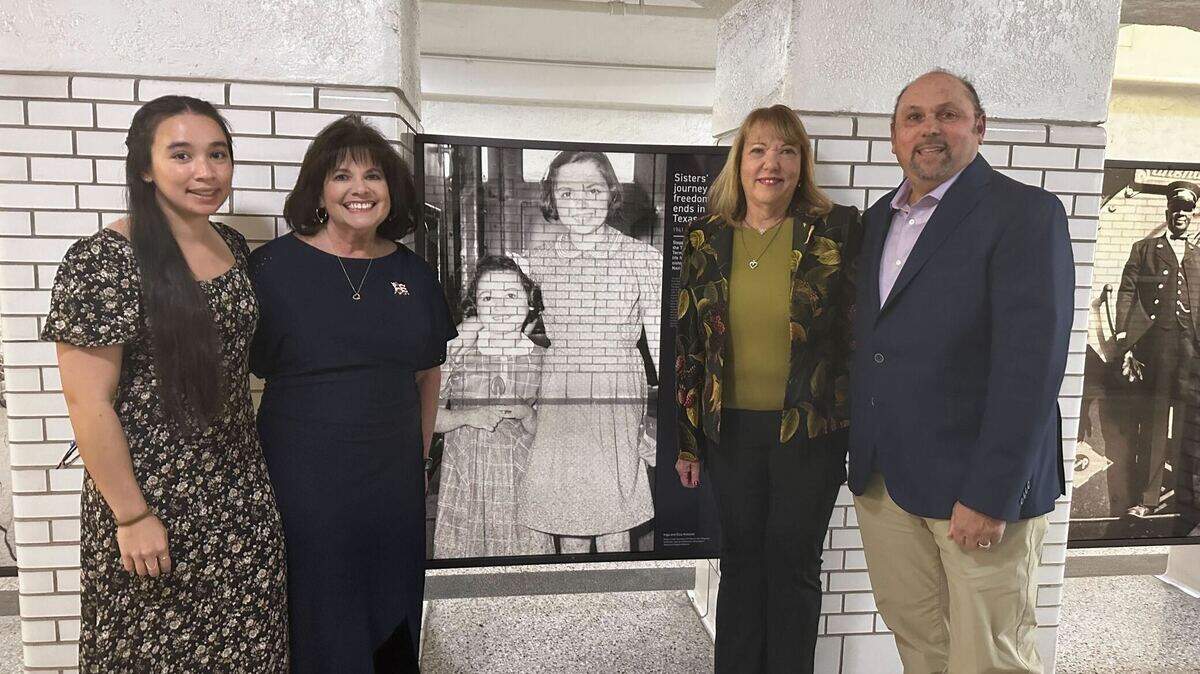 Samantha Leung, Stephanie Leung, Carol Pearson and Mark Kessler, left to right, family members of the Kokotek sisters gathered around their photo at the T&P Station in Fort Worth on Monday, Dec. 2.