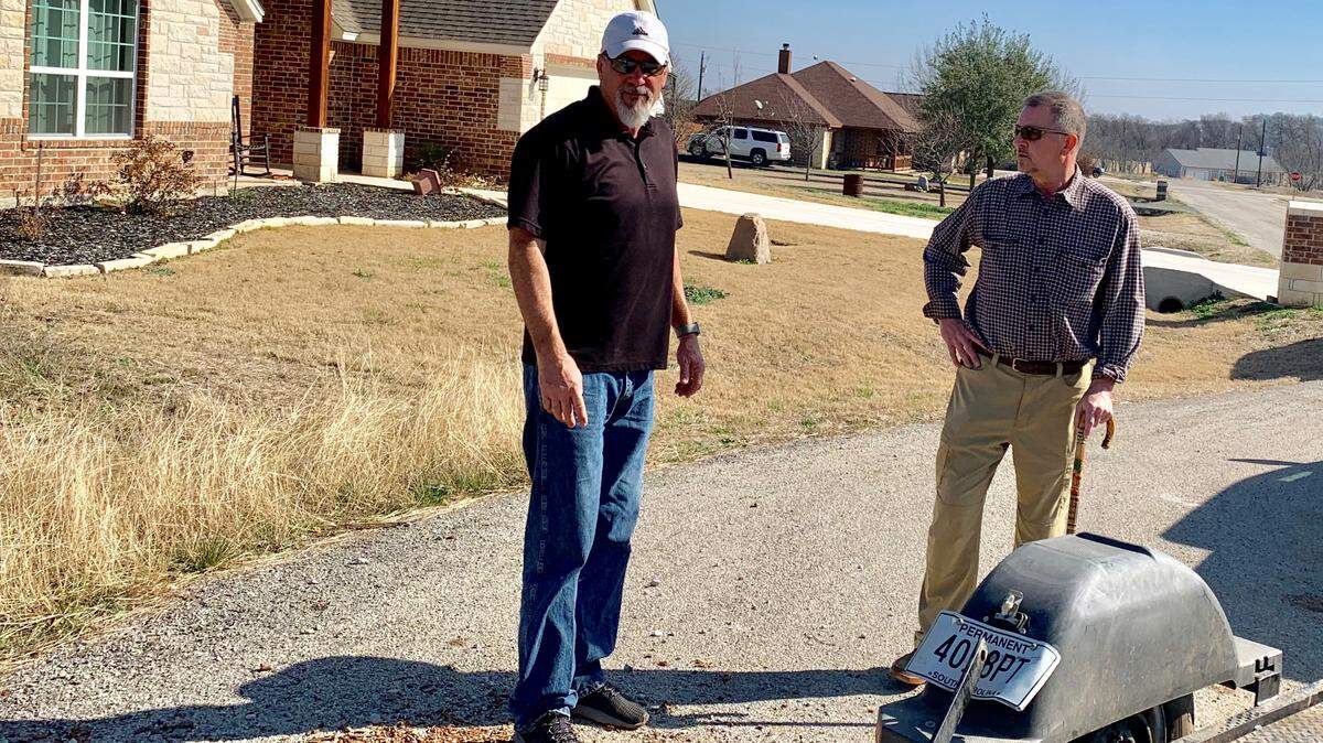 Greg Davis (right) owner of Capstone Construction, checks out progress on construction southwest of Fort Worth. Some of Davis’ properties may no longer qualify for private water wells because of changes in state law.
