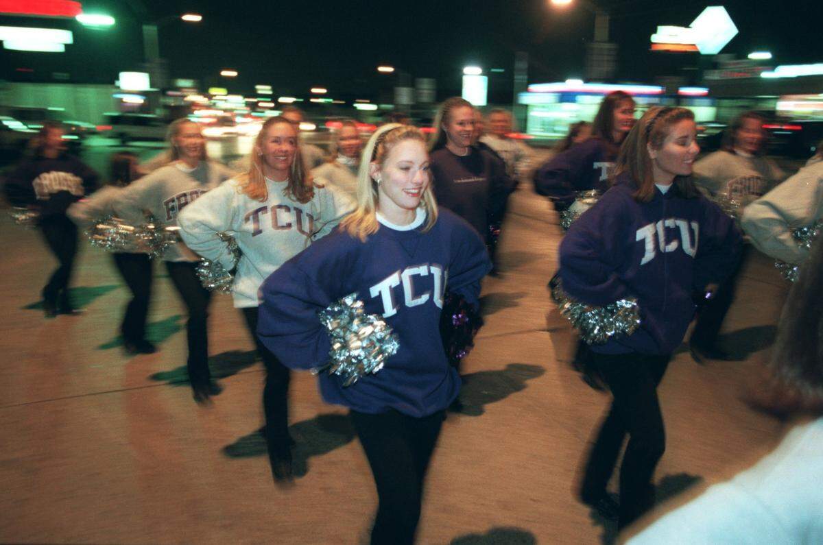Nov. 6, 1998: The TCU Showgirls lead a parade west down Berry Street.