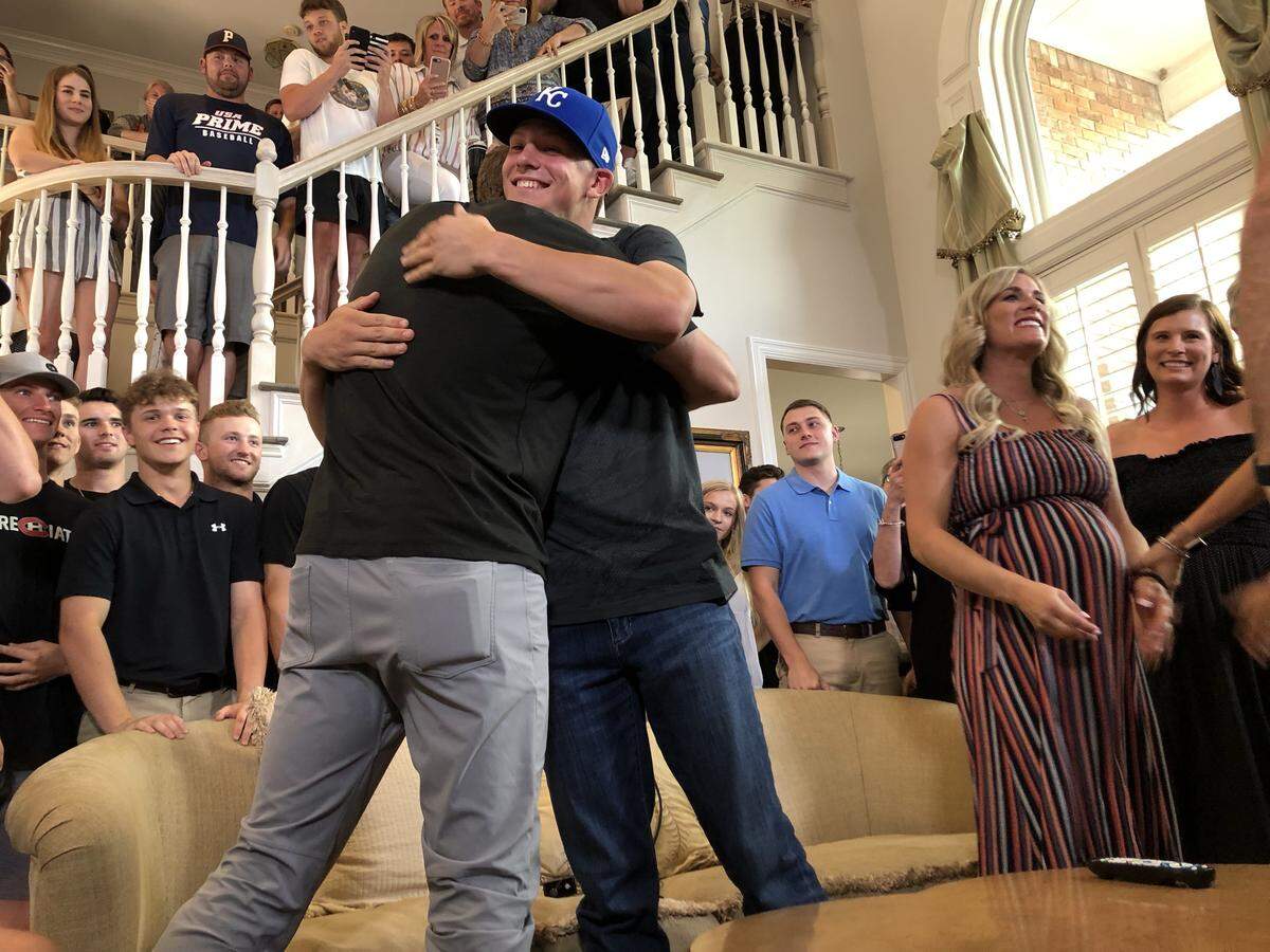 Bobby Witt Jr., right, embraces his father, Bobby Witt, shortly after he was selected Monday by the Royals with the second overall pick in the MLB draft.