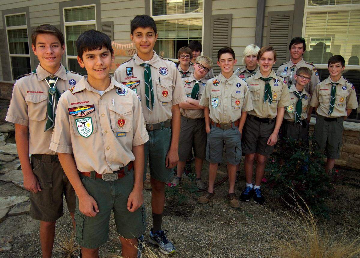 Sept. 27, 2015: “Troll Patrol” and Troop 32 Eagle Scouts (from left) Joe Trenton, 14; Nicholas Bellinger, 15; and Brad Greer, 14, with other members of their patrol at The Legacy at Bear Creek Assisted Living and Memory Care in Keller. “Troll Patrol” and Troop 32 Eagle Scouts built raised flower beds, a pergola and benches, and created a koi pond, as part of their Eagle Scout projects. A fourth Eagle Scout from the troop, Parth Purohit, created a rose garden around the flagpole in front of the facility. The 13-member “Troll Patrol,” all members of Boy Scout Troop 32 in Keller, are regulars at the facility, making improvements and helping residents with technology. They were awarded certificates and recognized for their contributions by the staff and residents.
