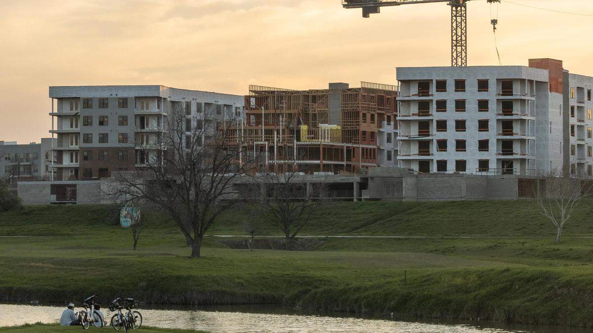 New apartments are under construction on the west bank of Trinity River, just north of West Seventh Street in Fort Worth, on March 12, 2024. The site is not far from a future bypass channel, which will reduce flood risks, and the future Panther Island redevelopment closer to downtown.