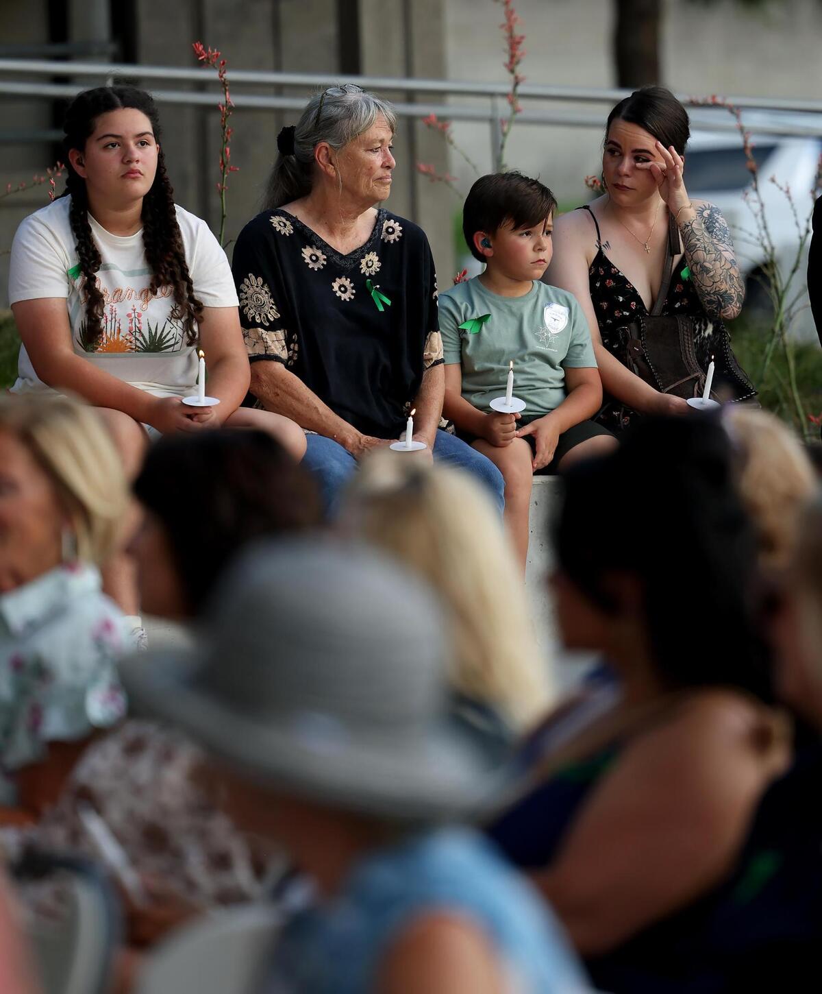 Community members attend a candlelight vigil for the Hill Country flood victims on Monday, July 14, 2025, at Fort Worth City Hall.