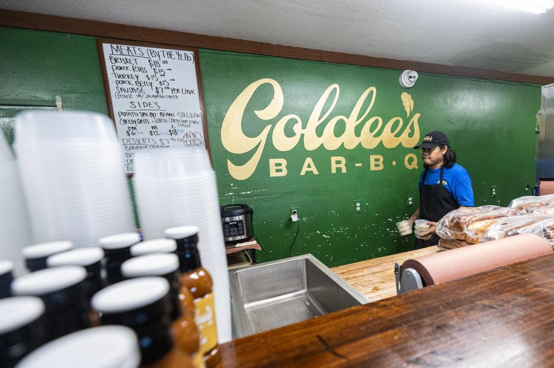 Nupohn Inthanousay, one of the five owners of Goldee’s Barbecue, brings portions of sticky rice to the hot box for service prior to opening at its location in Fort Worth on Friday, June 28, 2024. Inthanousay said he was encouraged by his fellow owners to incorporate dishes from his Lao culture into the menu which resulted in the Lao Sausage served with sticky rice & jeow som and the Mango sticky rice dessert.