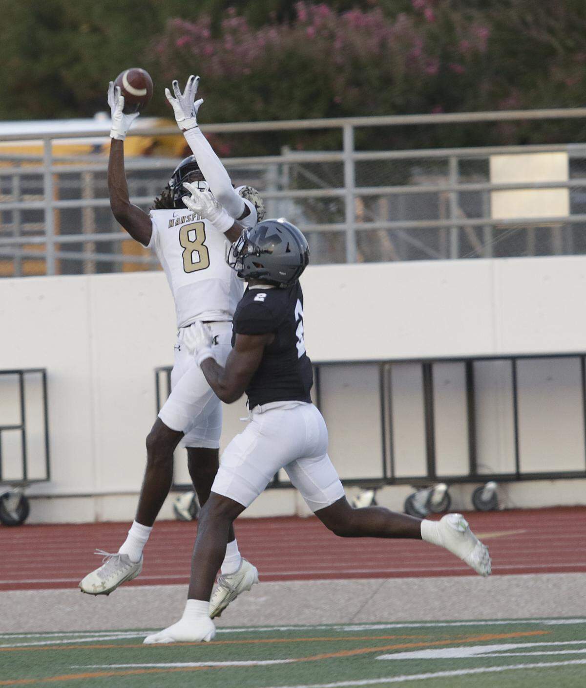 Mansfield’s Zion Robinson (8) grabs a halfback pass for a touchdown against Arlington Martin during their game on Thursday, September 11, 2025 at Maverick Stadium in Arlington Texas.