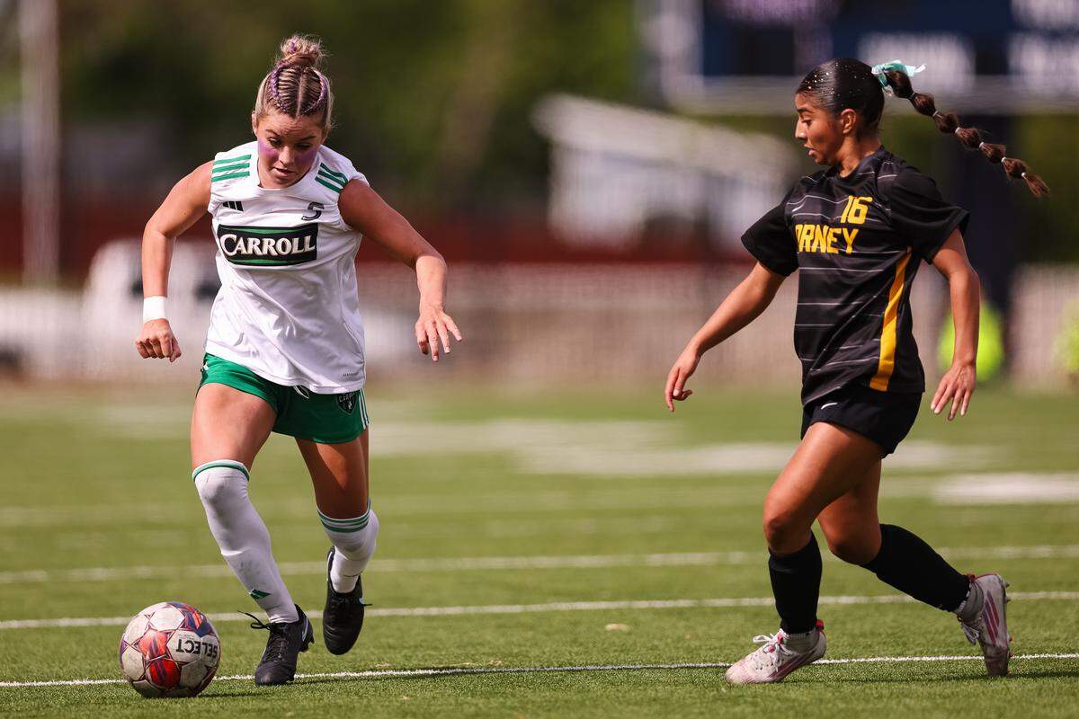 Southlake Carroll midfielder Audrey Anderson (5) dribbles the ball past a Forney defender in a UIL Class 6A Division 2 girls soccer state semifinal on Saturday, April 4, 2026, at Memorial Stadium in Mesquite, Texas.