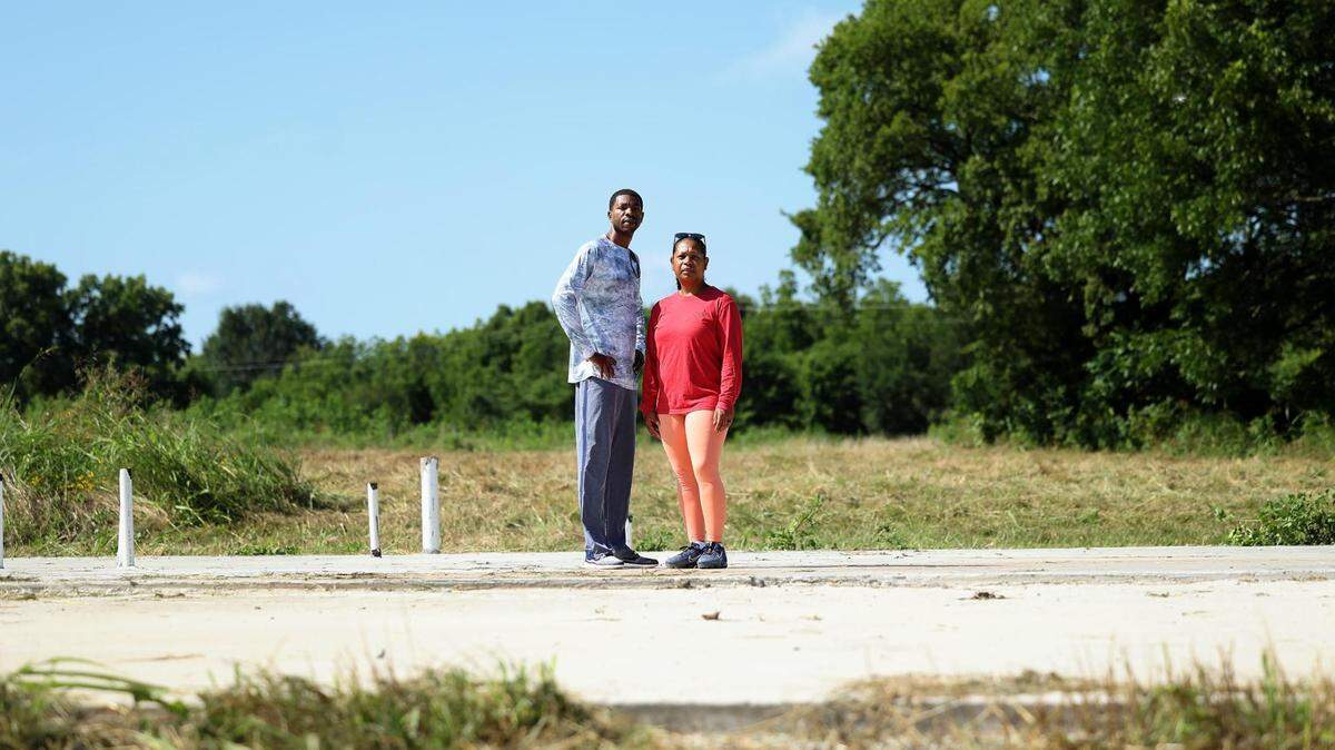 Charlet and Kamian Steele stand on the slab of what they dreamed would be their barndominium build in Greenville, Texas. The couple is out around $40,000 after builder Zach Holt abandoned the project and disappeared.