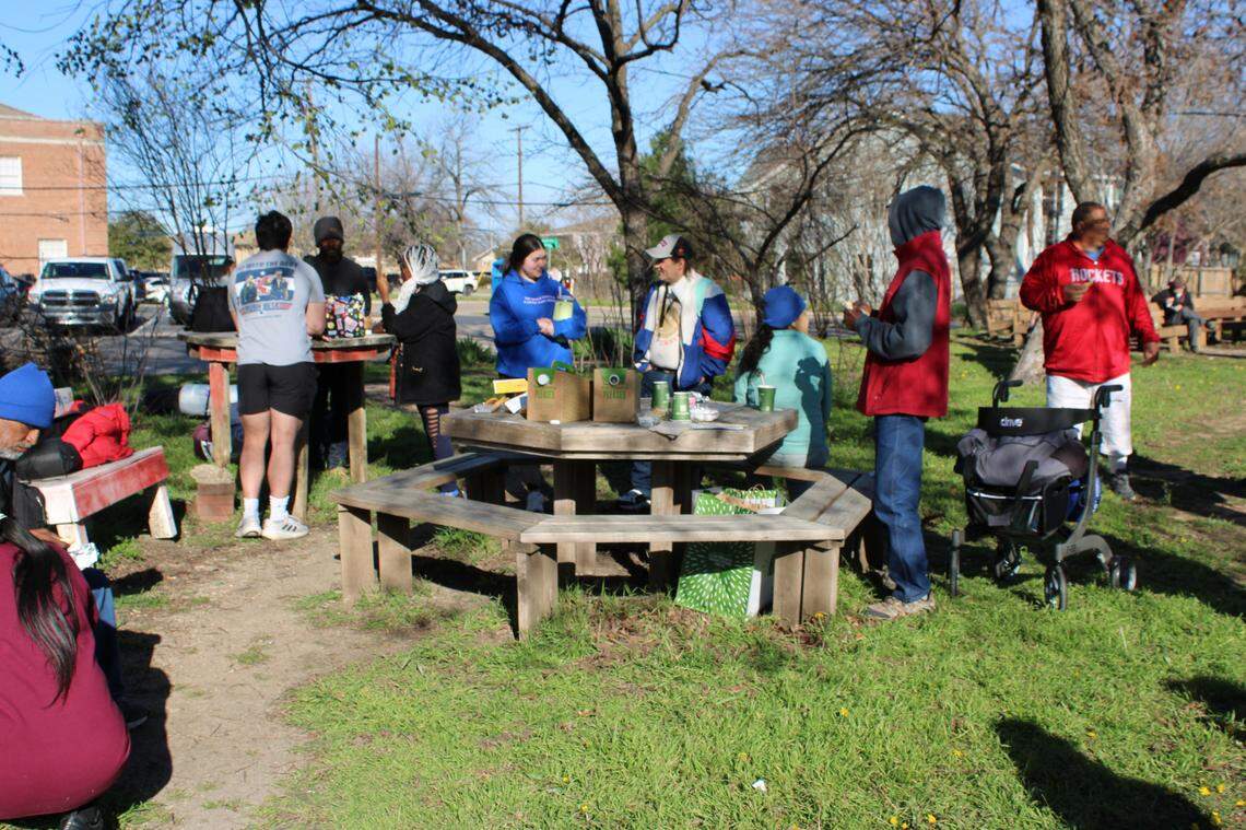 A gaggle of TCU students meet up with many from around Fort Worth who have experienced homelessness. “Bingo in the Park,” as the gathering is called, provides the warmth of personal connections.