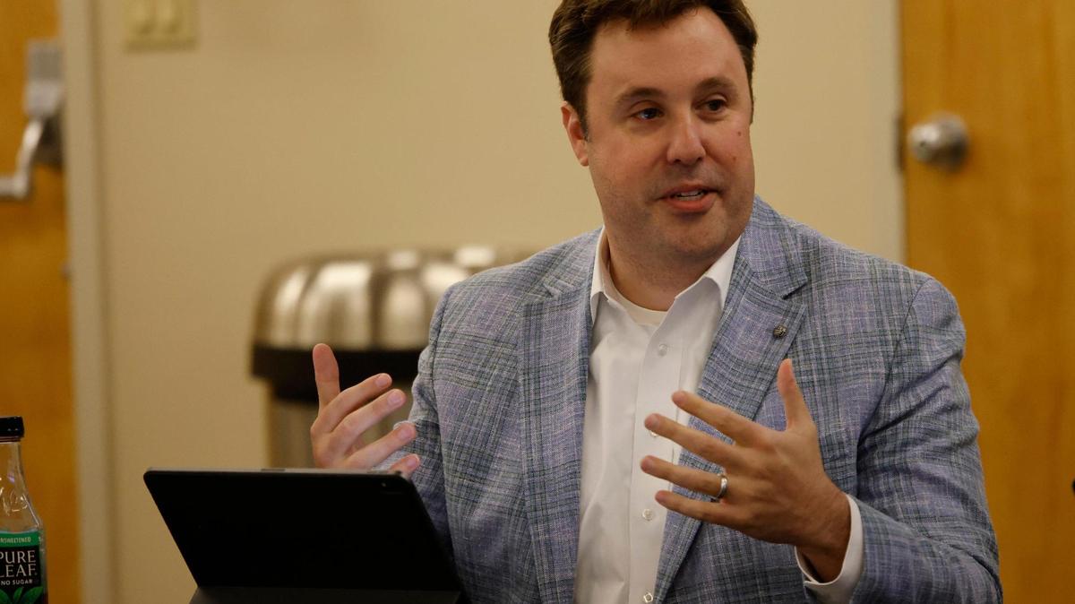 Tim Davis talks about choosing his new born sons name as he thanks the board for having a meeting so he could get out of the house during a JPS Health Network monthly Board of Managers Meeting in the OPC Auditorium at John Peter Smith Hospital in Fort Worth, Texas, Thursday, May 08, 2025.