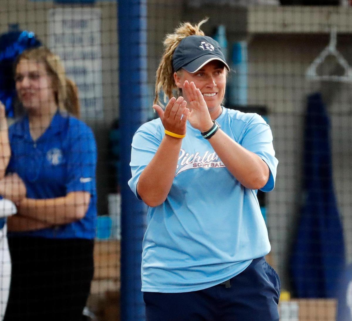 Richland head coach Stephanie Graham celebrates a good play by her team during a 5A Region I Bi-District softball playoff game at Brewer High School in White Settlement, Texas, Friday, April 30, 2022. Richland defeated Brewer 12-3 to move on to the next round. (Special to the Star-Telegram Bob Booth)