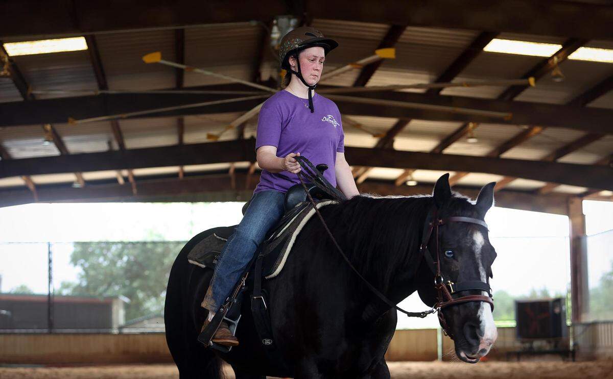 Lydia Wimberley rids Astri around the arena during her equine-therapy session on Monday, May 9, 2022, at Wings of Hope Equitherapy in Cleburne. Wimberley has been coming to Wings of Hope for 14 years.
