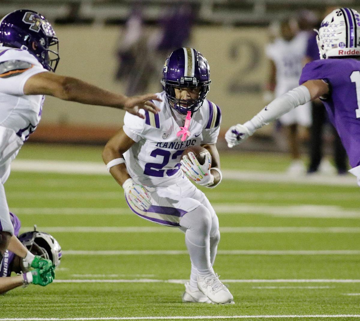 Chisholm Trail’s William Quintana picks up yardage during a UIL football game at Farrington Field Stadium on Thursday, October 4, 2024.