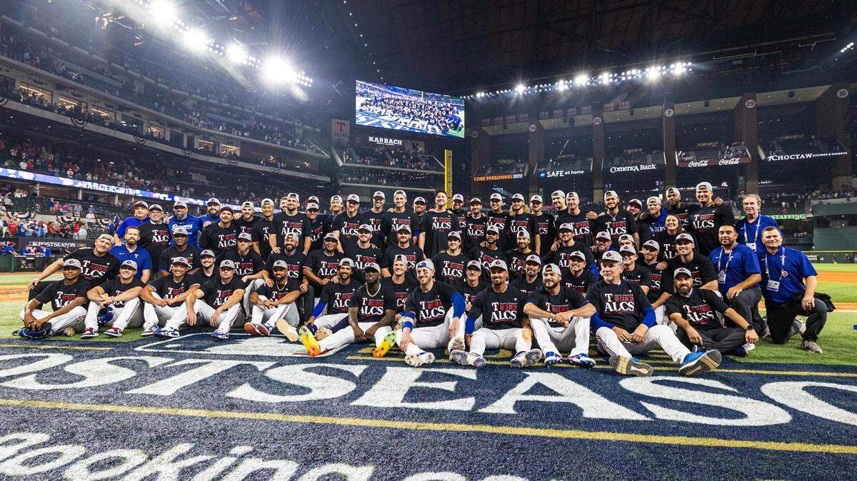 The Texas Rangers gather for a group picture after winning game three to clinch the ALDS between the Texas Rangers and Baltimore Orioles at Globe Life Field in Arlington on Tuesday, Oct. 10, 2023.