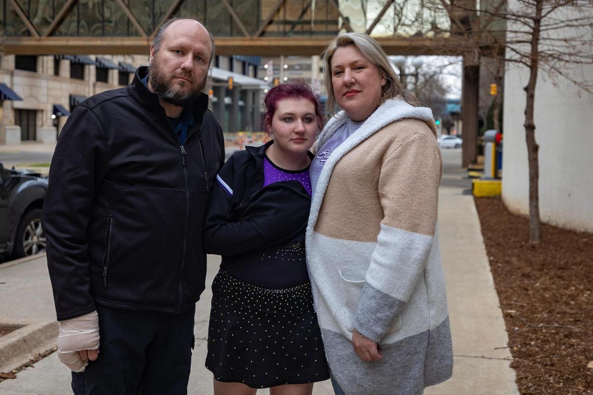 Raymond Vail and Charity Harkey-Vail, with their 16-year-old daugher Elaine, pose for a portrait in downtown Oklahoma City, Okla., on Feb. 18. Elaine was enrolled in a residential program for teens with autism at Fort Behavioral Health in January before it was abruptly shut down for 30 days by the state of Texas.