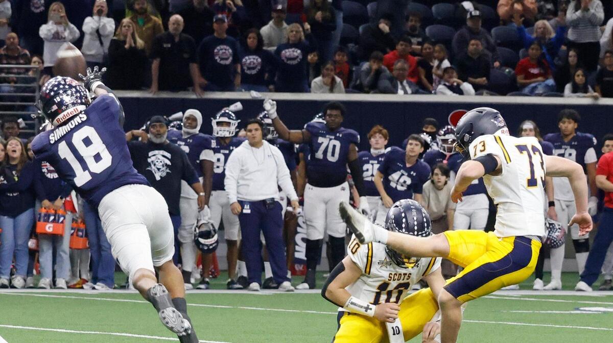 Highland Park kicker Sutton Stock (73) kicks the winning field goal almost blocked by Denton Ryan running back Byran Simmons (18) during the UIL 5A D1 Semifinals football game at The Ford Center in Frisco, Texas, Friday, Dec. 13, 2024.