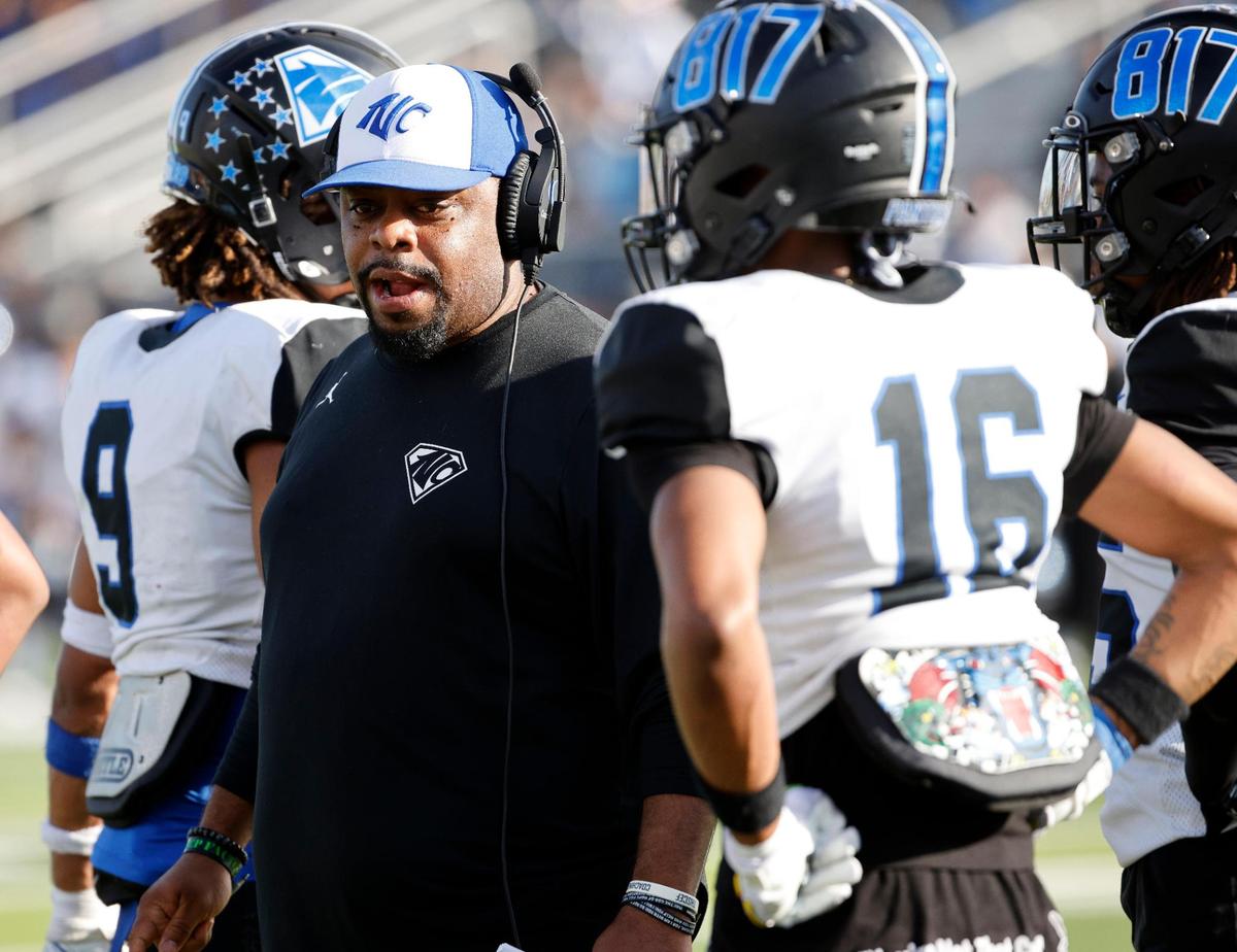 North Crowley defensive assistant Dnarius Green talks to players during an injury timeout during the first half of a UIL Conference 6A Division 1 quarterfinal football playoff game at Dragon Stadium in Southlake, Texas, Saturday, Dec. 02, 2023.