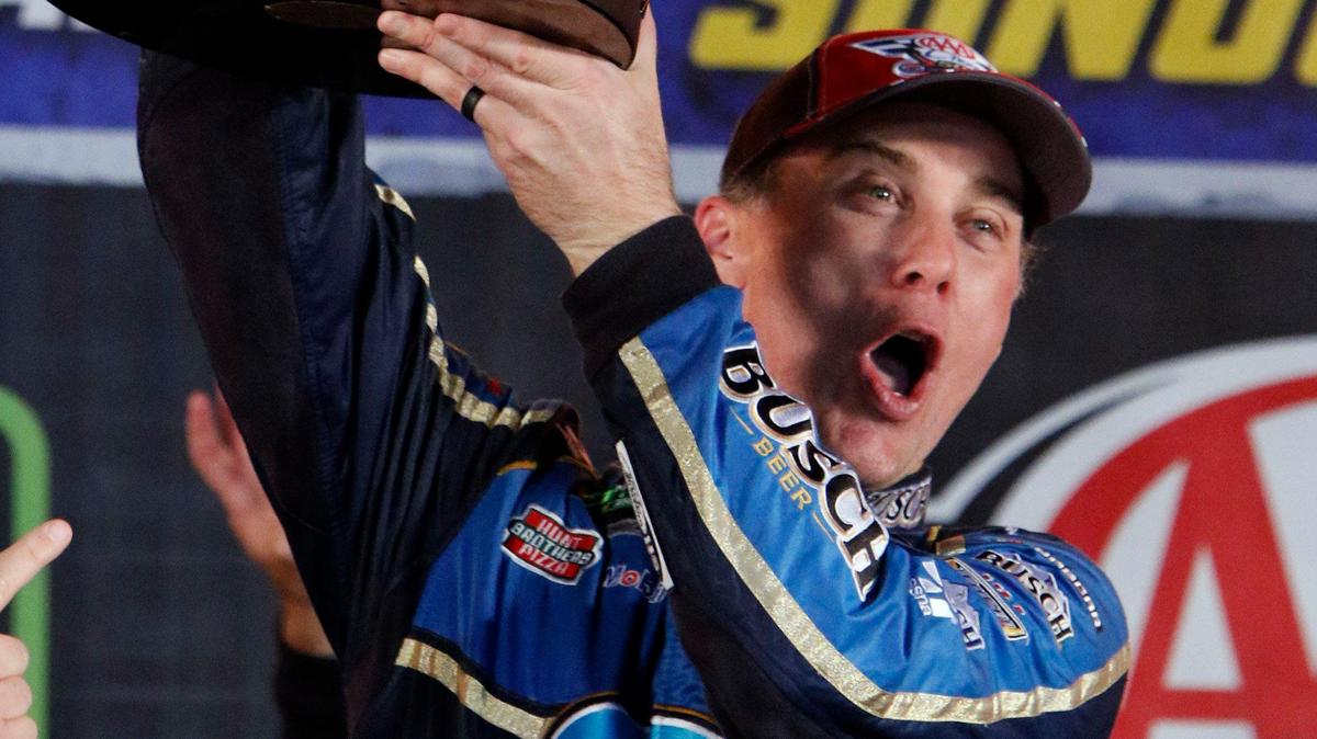 Monster Energy NASCAR Cup Series driver Kevin Harvick holds the trophy in Victory Lane after winning the AAA Texas 500 at Texas Motor Speedway in Fort Worth, Texas, Sunday, Nov. 3, 2019.
